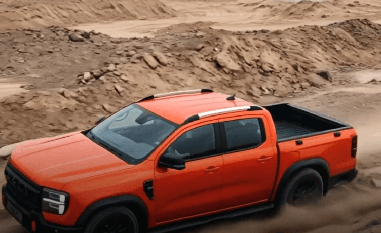 Orange Rely R8 crossing rough terrain